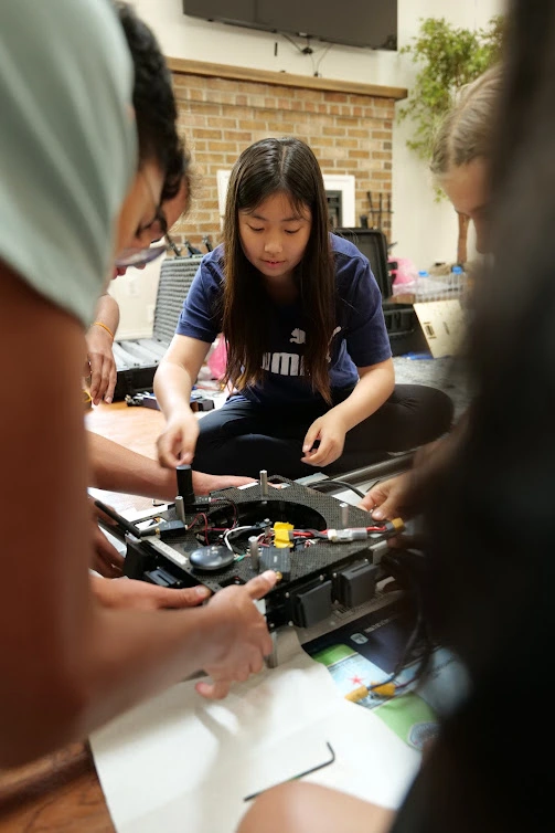 Our electromechanical members working on an assembly together